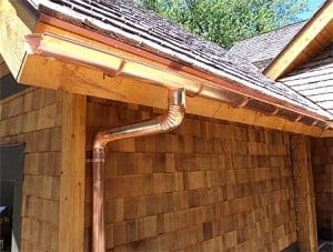 copper gutter on wood home